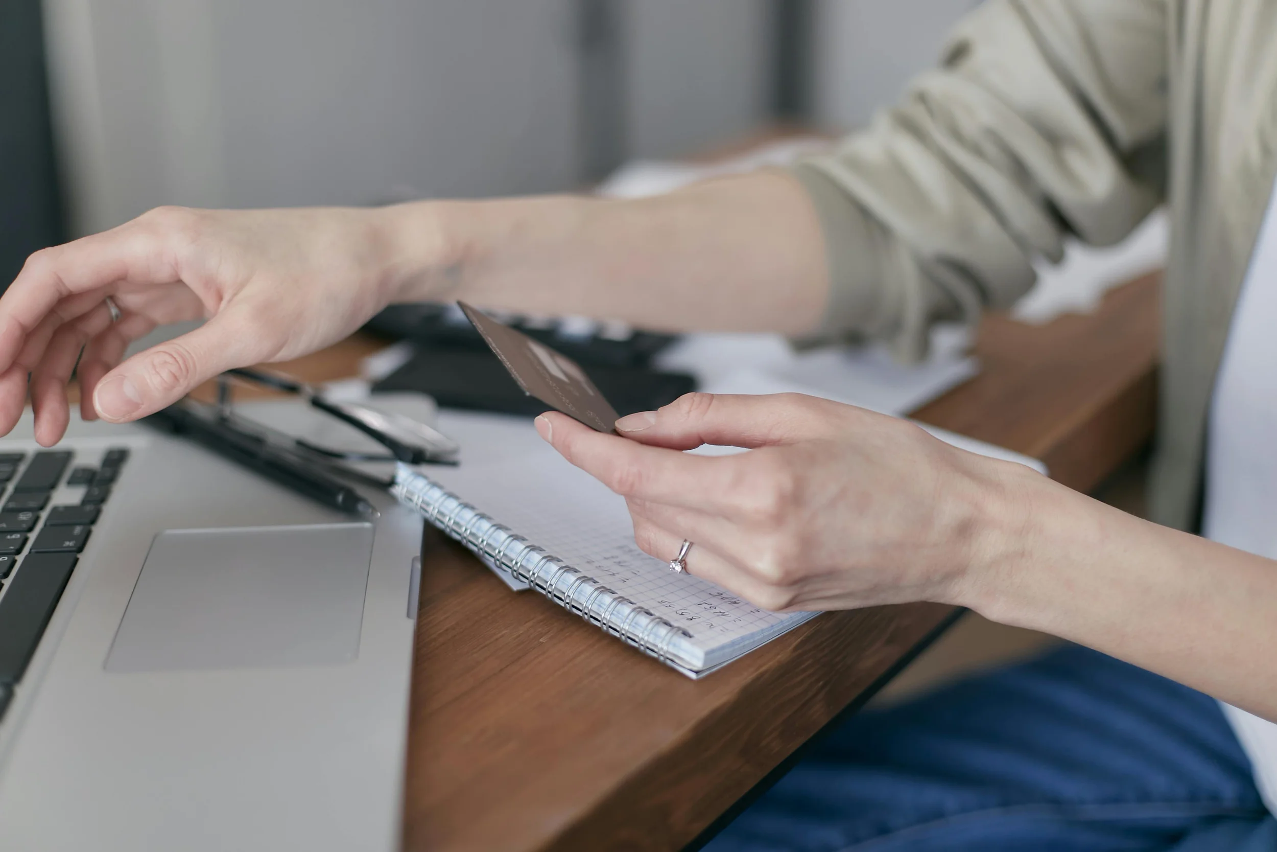 Woman reviewing credit card statements for debt consolidation